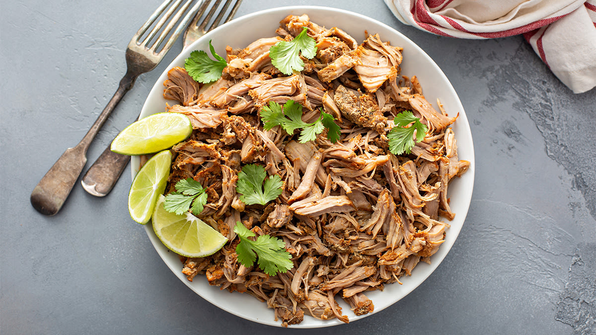 Dutch Oven Carnitas Recipe Cooks Up Crispy + Tender Shredded Pork — No Searing Needed