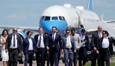 Awkward moment JD Vance attempts to confront Kamala on tarmac – before holding presser in front of Air Force 2