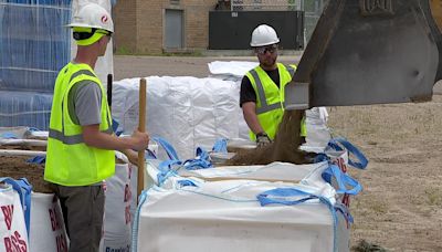 Sandbagging to protect Black Dog Power Station from Minnesota River flooding