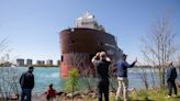 Tugboat frees freighter after it runs aground in Detroit River near Belle Isle