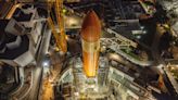 Space Shuttle's Massive Tank Hoisted Atop Rocket Boosters for Historic Display