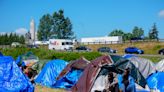 Hundreds of asylum-seekers are camped out near Seattle. There’s a vacant motel next door