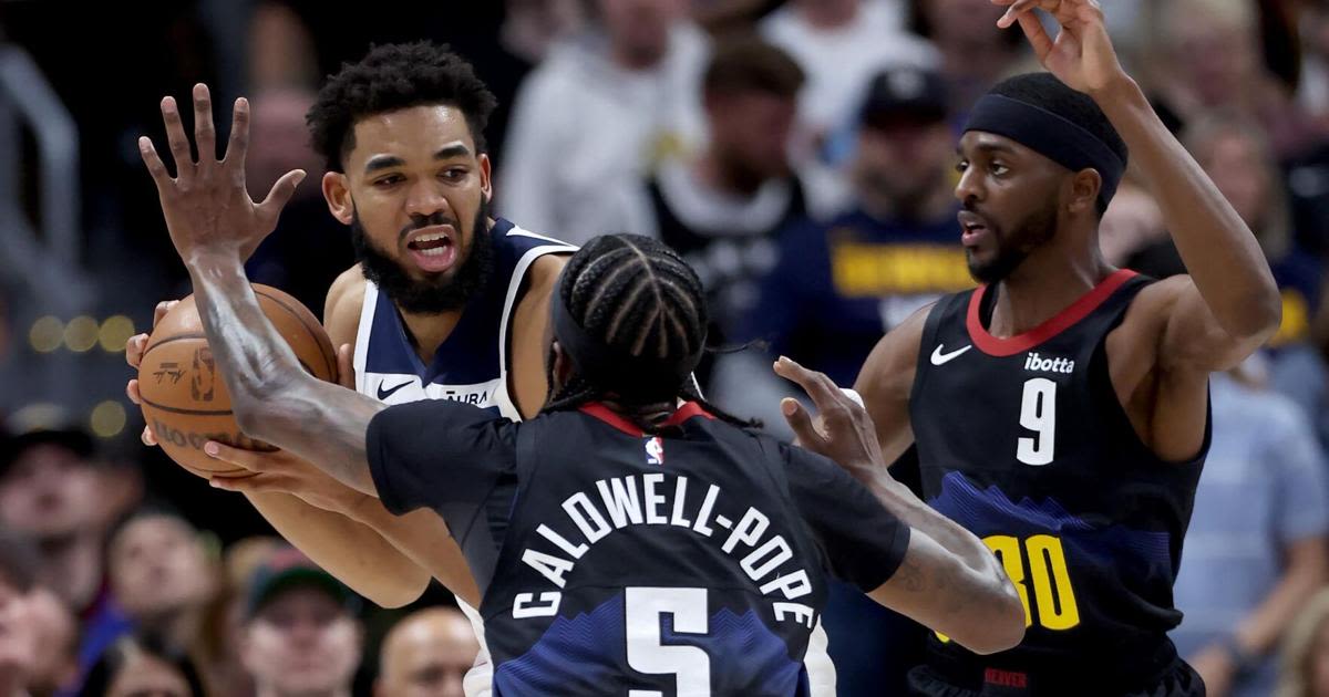 ...first quarter against the Denver Nuggets' Justin Holiday and Kentavious Caldwell-Pope in Game 5 of the Western Conference second-round playoff series at...