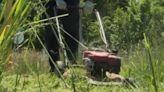 Good Samaritan helps mow tall grass at Flint park