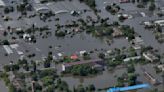 Families scramble for food and dry places to sleep after a dam collapses in Russian-occupied Ukraine