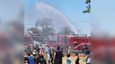 Firefighters use fire truck, hose for elementary school water day fun