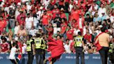 Morocco fans rush field during Olympic soccer opener vs Argentina. Game suspended, goal disallowed