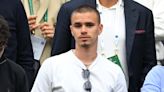 Romeo Beckham cheers as he attends Wimbledon day 3