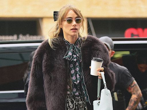 Suki Waterhouse puts on a leggy display in short shorts and boots