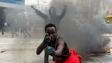 Tear gas, stones and flames as Kenya protesters say 'Ruto must go!'