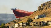 Salt Lake City wildfire prompts mandatory evacuations as more than 100 firefighters fight blaze