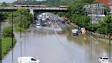 A major highway and roads are flooded as torrential rains hit Canada's largest city