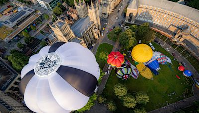 Hot air balloons take to city skies to launch annual fiesta