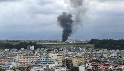 At least 18 killed in Nepal after plane slips off runway during takeoff