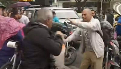 Ciudadanos se agarraron en vivo en Noticias Caracol; se dieron hasta con un balde