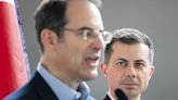 Colorado Attorney General Phil Weiser, left, and U.S. Transportation Secretary Pete Buttigieg