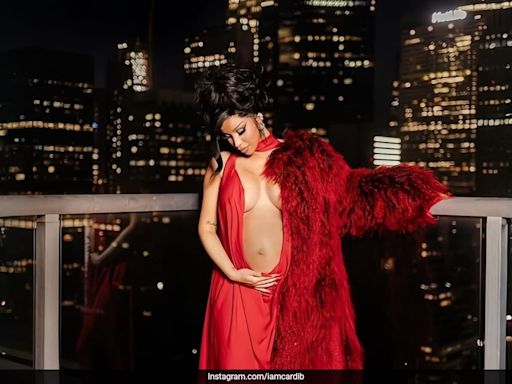 Cardi B Debuts Her Baby Bump In A Crimson Slip Gown With Cutouts And A Fur Coat