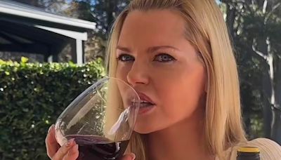 Sophie Monk shows off her ample cleavage as she spruiks budget wine