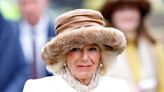 Queen Camilla's regal bright white coat is perfect for the snowy weather and we're obsessed with her oversized cozy hat