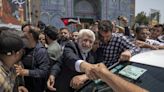 Iran holds runoff presidential vote pitting hard-liner against reformist after record low turnout