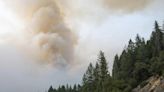 Crews battle wildfires across the US West and fight to hold containment lines