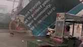 Terrifying video shows billboard collapse in severe winds, strike motorist