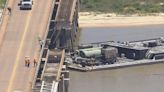 Barge collides into bridge off Texas coast, causing oil spill