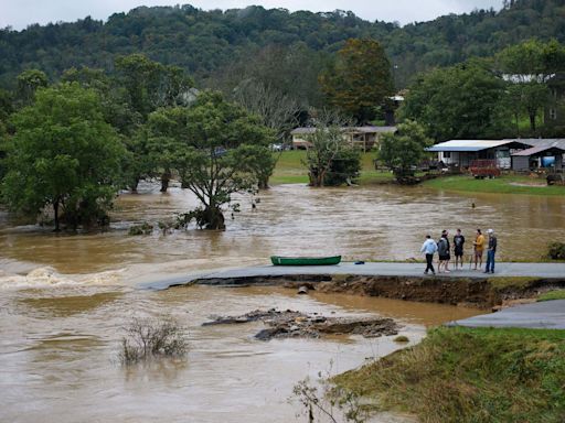 Pregnant mum of two is 'completely trapped' in floods