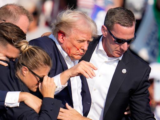 Trump fundraises off assassination attempt as Biden suspends campaign ads in aftermath of rally shooting