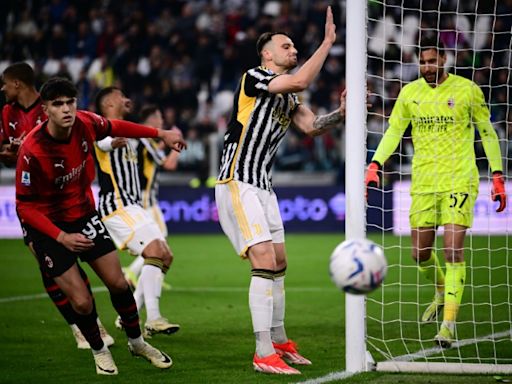 Depleted Milan hold Juve to close in on Champions League