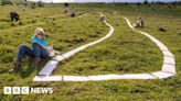 Long Man of Wilmington: Chalk carving repainted by volunteers