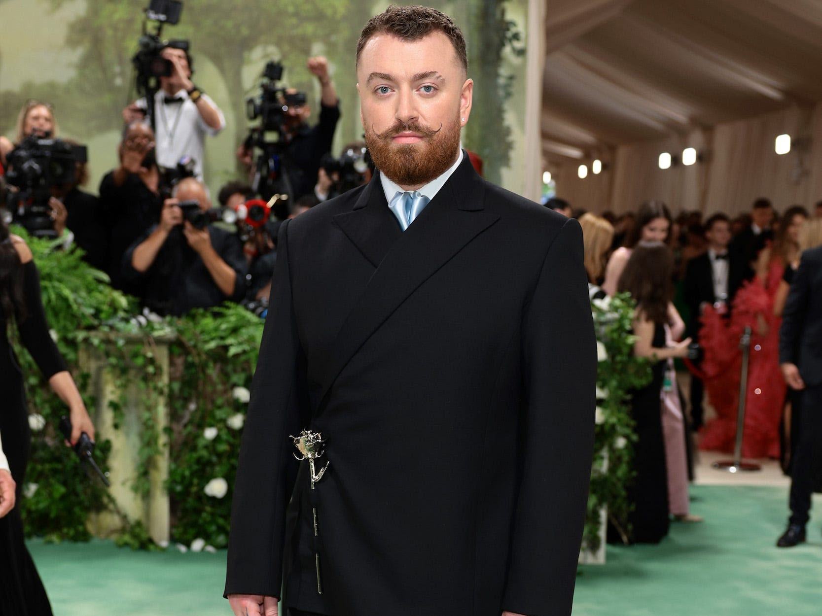 A fan caught Sam Smith wearing $2,450 jeans that were entirely ripped across the back for a recent flight