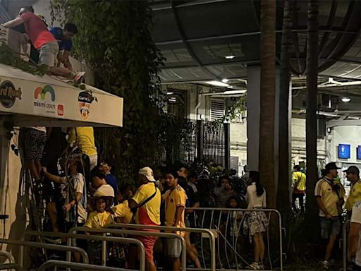 WATCH: Police evict ticketless people as fans climb through vents to enter stadium ahead of Copa America final | Football News - Times of India