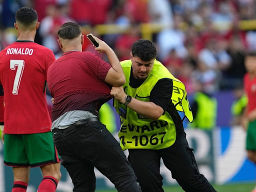 Euro 2024: Security increased after pitch invaders aim for Cristiano Ronaldo selfies