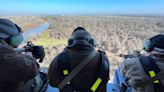 In Texas, hunters shoot feral pigs from helicopters