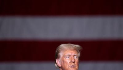 Trump claims ‘no conflict’ during Arlington national cemetery visit – as it happened