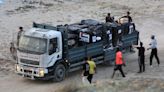 Israel right-wing settlers question delivery of aid to Gazans, peace activists advocate for passage of aid trucks