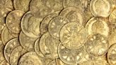 Gold coins worth $290,000 found under kitchen floorboard of English couple's home