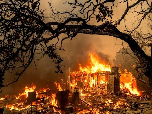 California burns as heat wave spreads across western U.S.