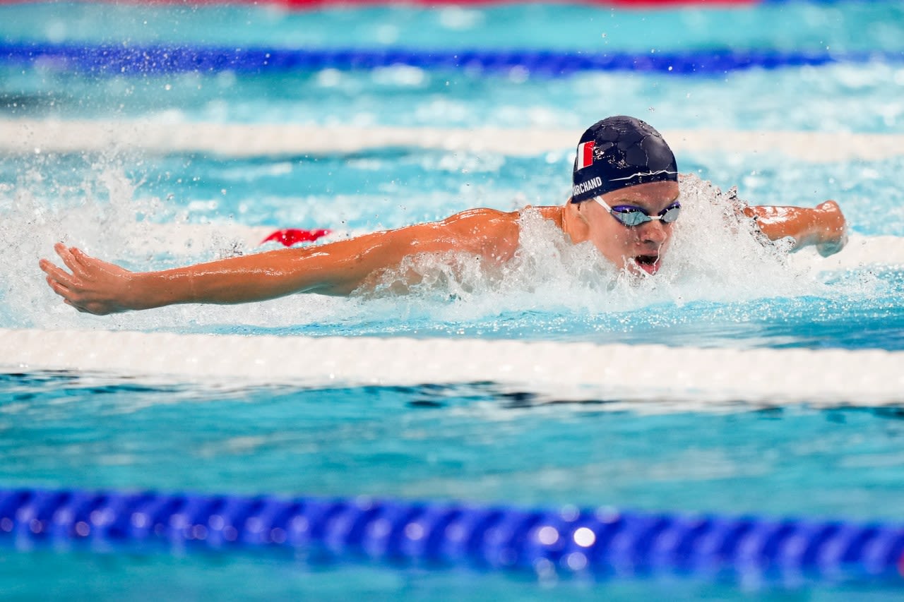 With French fans cheering every stroke, Marchand cruises to fastest time in men’s medley