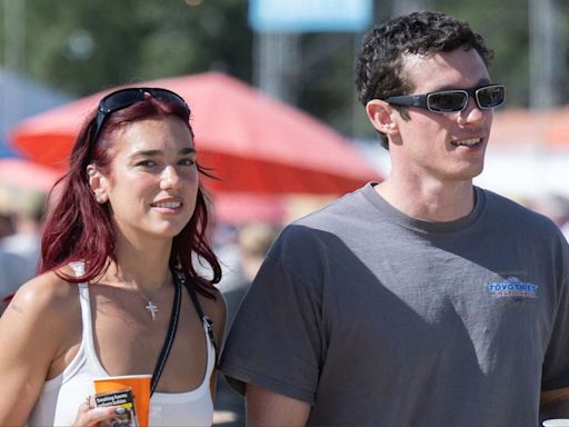 Dua Lipa Held Hands With Callum Turner While Wearing a High-Slit Leather Skirt at Glastonbury