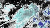 Carina strengthens into typhoon while 'meandering' offshore