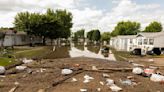 Flooding breaches levees in Iowa as more rain threatens