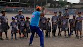 Baseball becomes a shelter for Venezuelan children in soccer-mad Peru