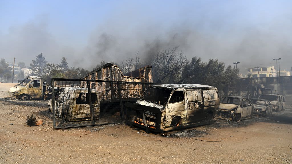 One dead and homes burnt to ground as fires die down in Greece