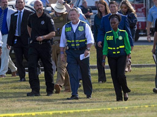 Teen accused in Georgia shooting rode to school with assault rifle hidden in his backpack, investigators say