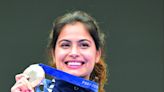 Manu Bhaker poses with her bronze medal in the 10m air pistol women’s final round at the 2024 Summer Olympics, on Sunday. Bhaker became the first Indian woman shooter to claim an Olympic medal, a...