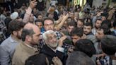 Iran holds runoff presidential vote pitting hard-liner against reformist after record low turnout