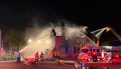 Flames ravage Windsor's abandoned 'rainbow house' on Ouellette in overnight fire