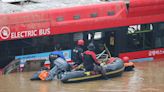 Rescuers pull out eight bodies from flooded South Korea tunnel as death toll rises to 35